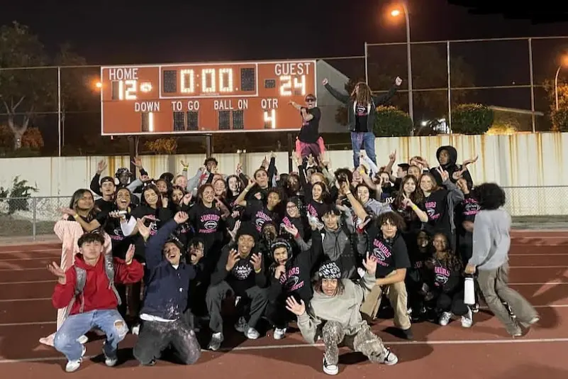 Juniors Posing In Front Of The Scoreboard